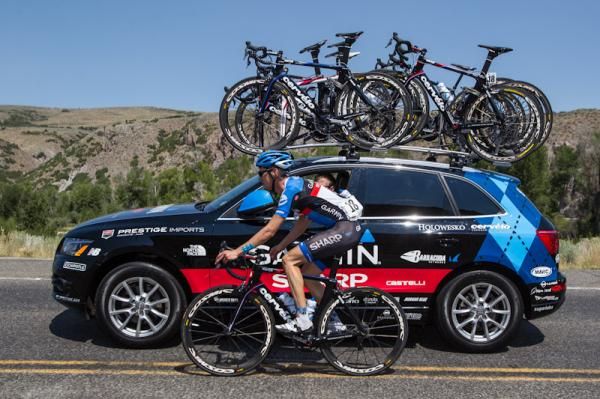 Alex Howes (Garmin) rides by the team car after a big crash