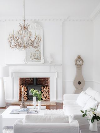 All white living room with log burning stove