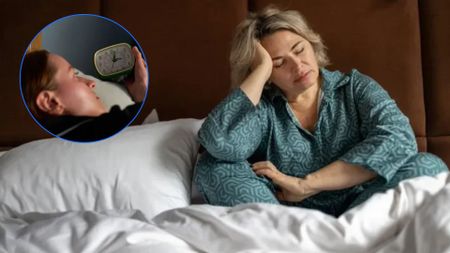 The image shows a blond woman sitting up in bed with her eyes closed and her head in her hands. Inset to the left, a dark haired woman in bed reaches for the clock - the time is 3 a.m.