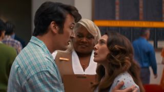 Miles Teller holding Elizabeth Olsen's shoulders with Da'Vine Joy Randolph standing between them. 