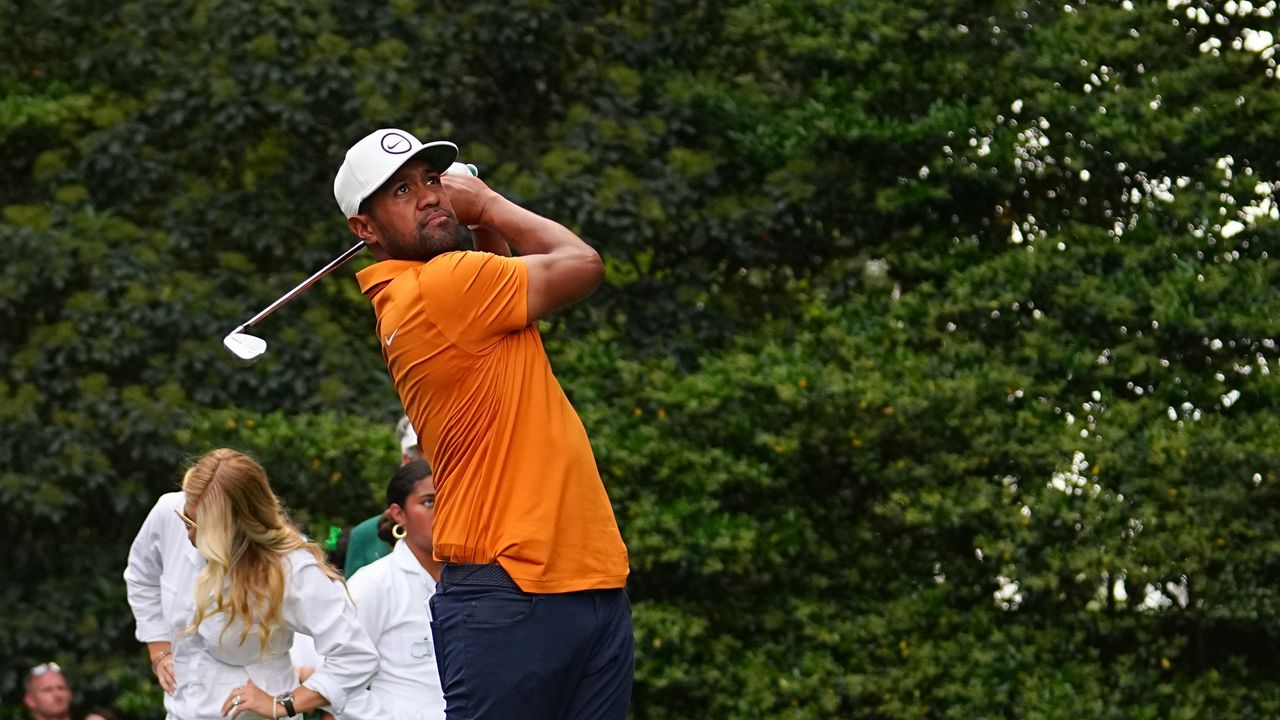 Tony Finau hits the ball during the Par 3 Contest prior to the Masters.