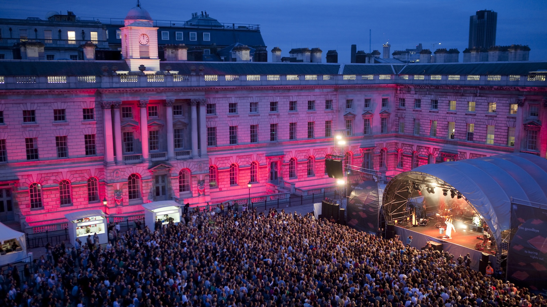 A view of the dramatically lit Somerset House building and couryard as the audience enjoys a performance by Florence and the Machine during the annual Somerset House Series. These outdoor concerts within the atmospheric courtyard of Somerset House, one of London's most impressive buildings, have become have become a unique event in the UK summer's live music calendar.
