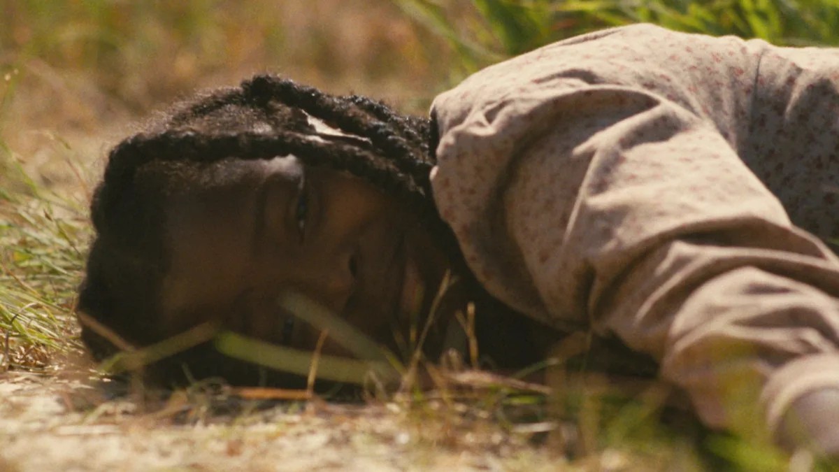 Naya Desir-Johnson as Sarah on the ground in Sarah's Oil