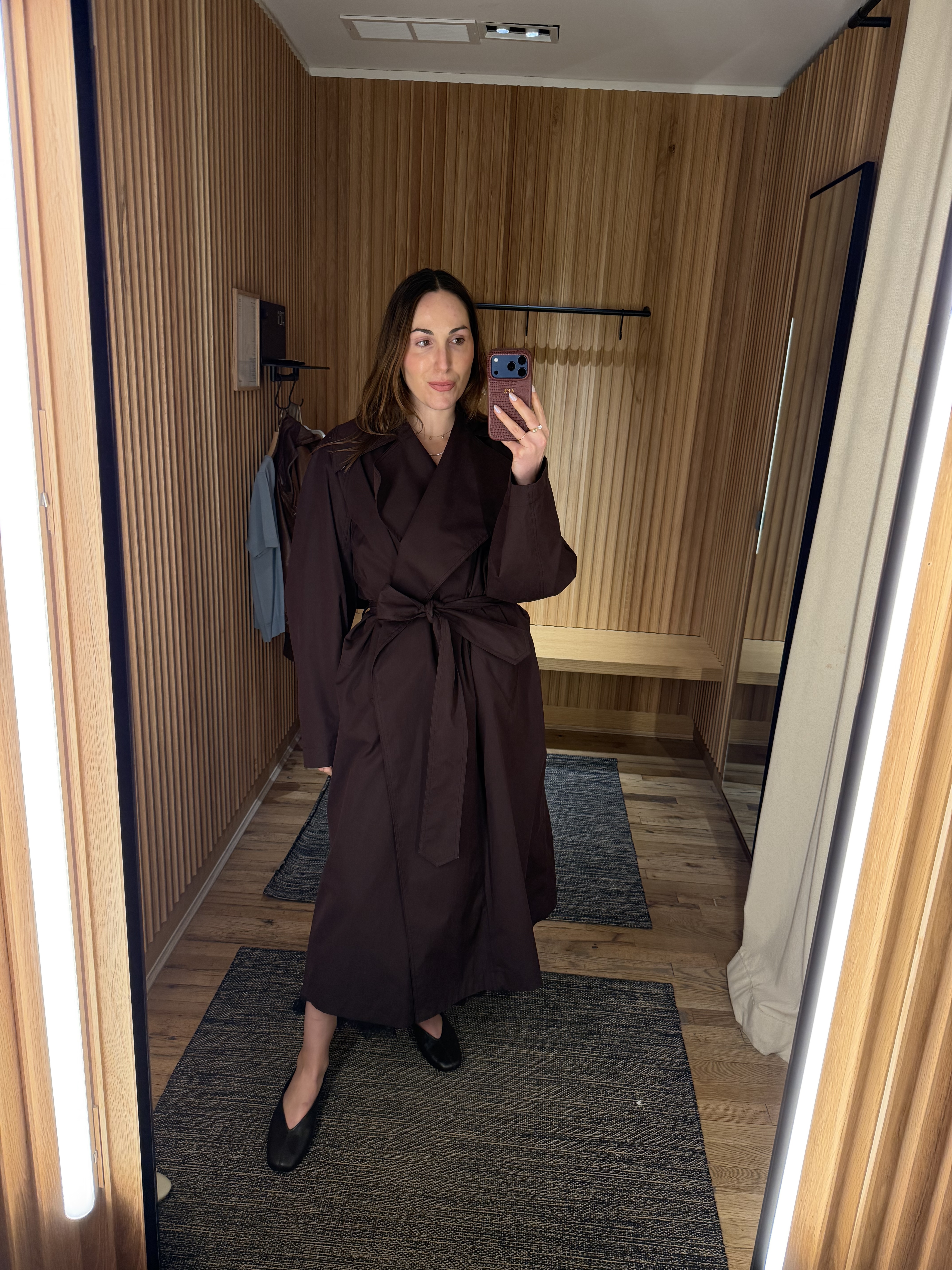 senior fashion editor Anna LaPlaca wearing Mango Selection pieces inside a store dressing room