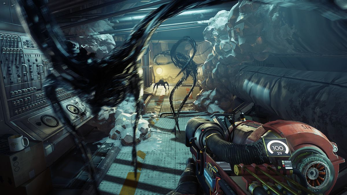 Prey screenshot showing gloopy alien enemies known as mimics heading towards the player character who wields a sci-fi weapon