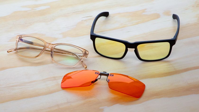 Three pairs of blue light blocking glasses on a table