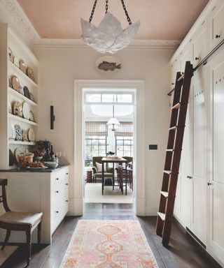 pantry with shelves and cabinetry