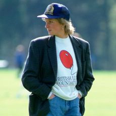 Princess Diana wearing a British Lung Foundation sweatshirt and blazer with a baseball hat