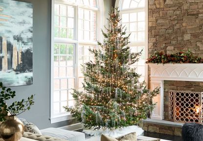 a living room with a christmas tree covered in tinsel