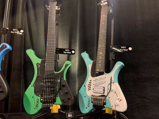 Marconi Lab's Hyper-SS (left) and Stratos guitars, on display at the 2023 NAMM show