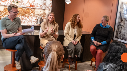 panellists Pip Rich, Portia Fox, Camilla Roger and Elina Grigoriou on stools in front of a live audience
