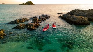 Two people setting sail