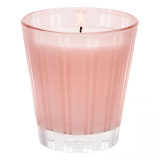 Nest's candle in a pink, tinted container