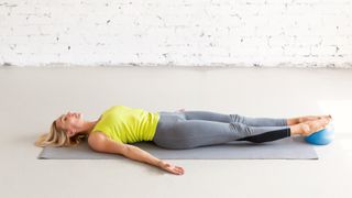 Image of woman stretching on yoga mat