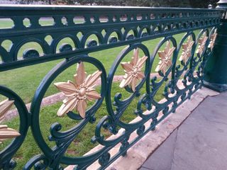 Cast-iron gates and railings should always be maintained. This Victorian bandstand has been restored to its original colours