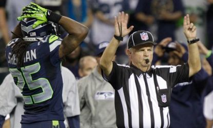 The Seattle Seahawks' Richard Sherman reacts to an official during the second half of a Monday Night Football game on Sept. 24: On the game's final play, the refs botched a call, handing the 