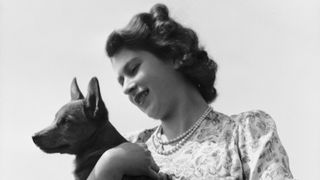 Princess Elizabeth with her pet Corgi Sue or Susan at Windsor Castle, UK, 30th May 1944. (Photo by Lisa Sheridan/Hulton Archive/Getty Images)