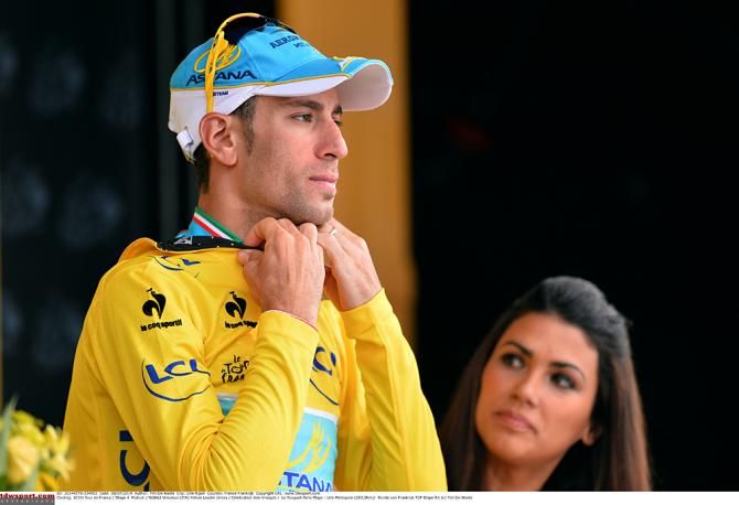 Vincenzo NIbali (Astana) pulls on the yellow jersey