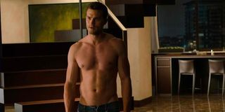 Jamie Dornan shirtless in Fifty Shades of Grey red room