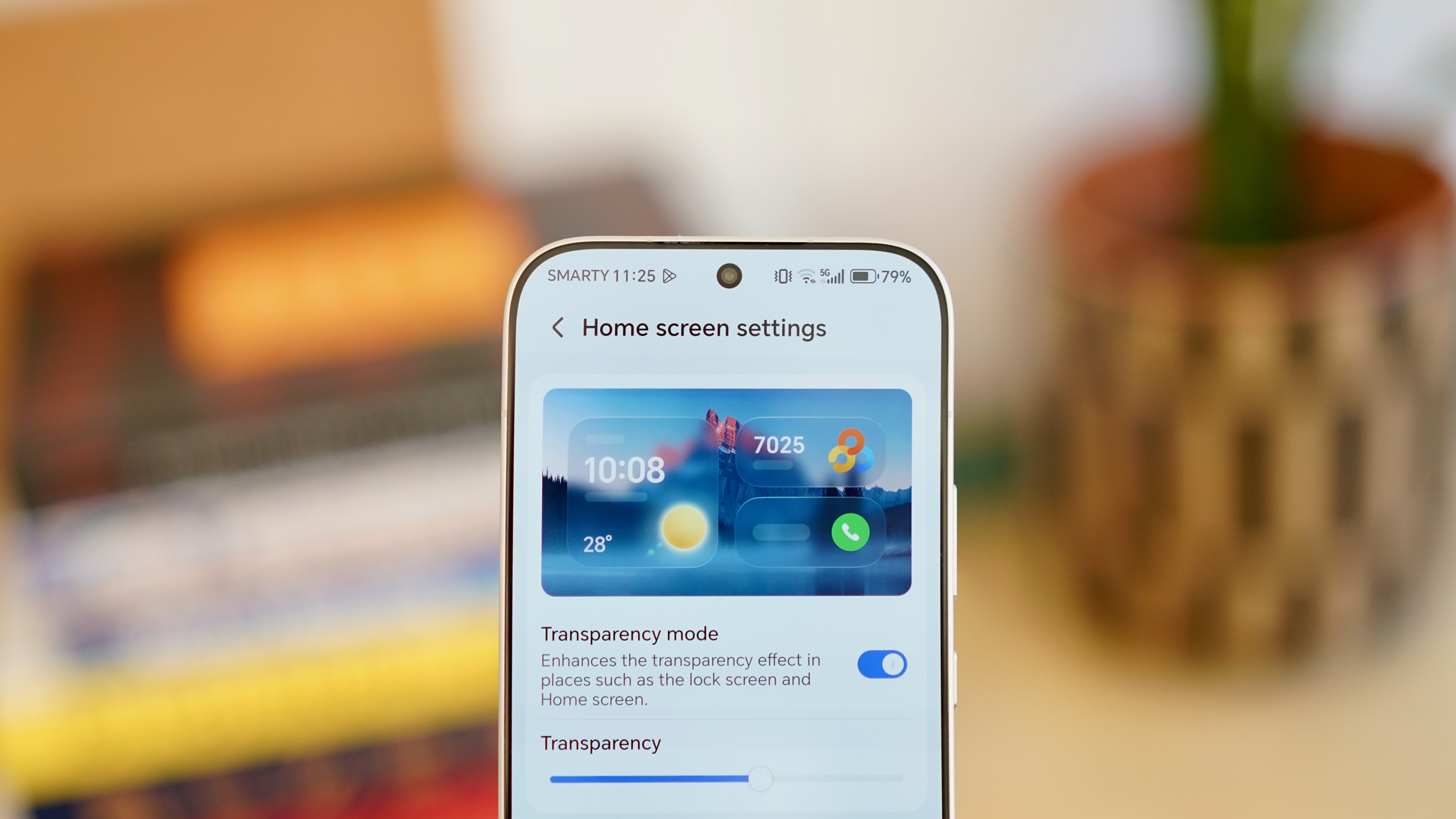 A white Honor 600 Pro resting on a wooden table