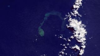 A satellite image showing a giant plume of discolored water beneath the surface