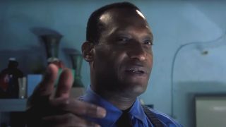 Tony Todd points forward while looking menacing in Final Destination.