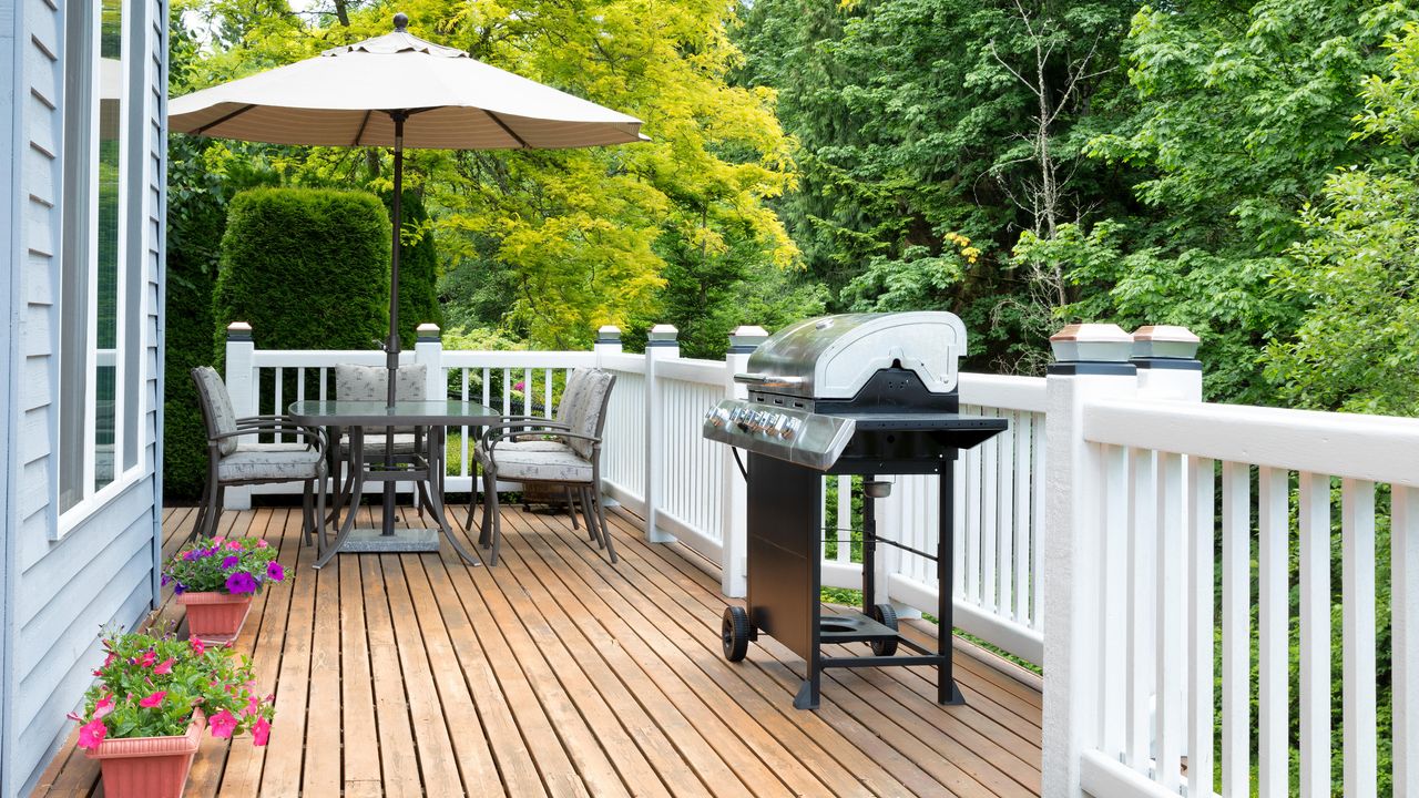 Home deck and patio with outdoor furniture and BBQ cooker