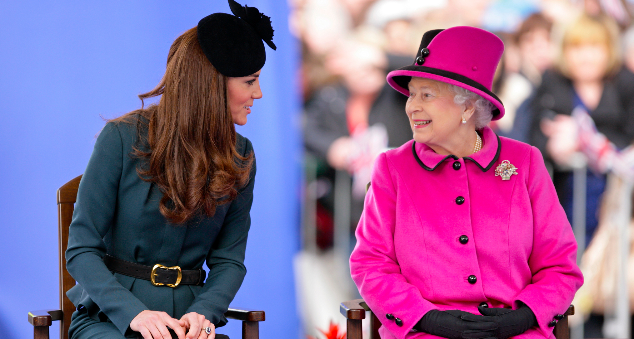 Kate Middleton sitting next to Queen Elizabeth, wearing a bright pink coat and hat