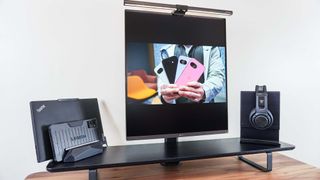 A full screen video on the LG DualUp monitor on top of the Oakywood Desk Shelf on the Oakywood Standing Desk Pro