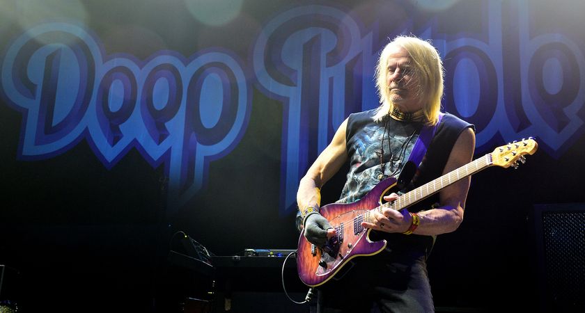 Steve Morse plays live with Deep Purple and takes a solo on on his signature Ernie Ball Music Man, with the band&#039;s logo visible in the background