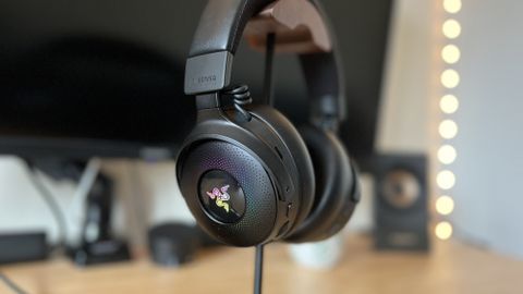 Razer Kraken V4 Pro gaming headset on a stand with RGB lighting on 