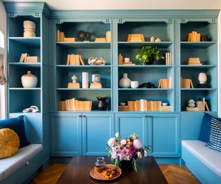 blue bookshelves in a living room with modern styling