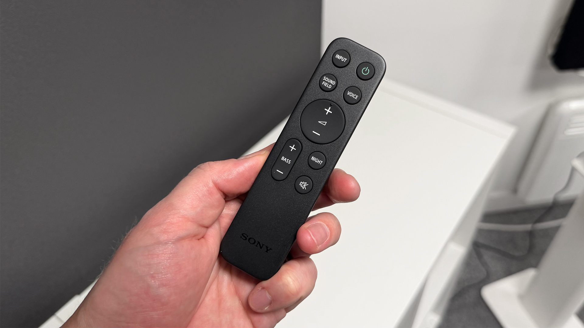 Sony Bravia Theatre Trio Dolby Atmos soundbar remote control held in hand