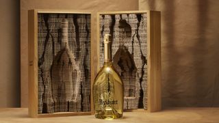 Ruinart Jeroboam and open case with cardboard relief inside