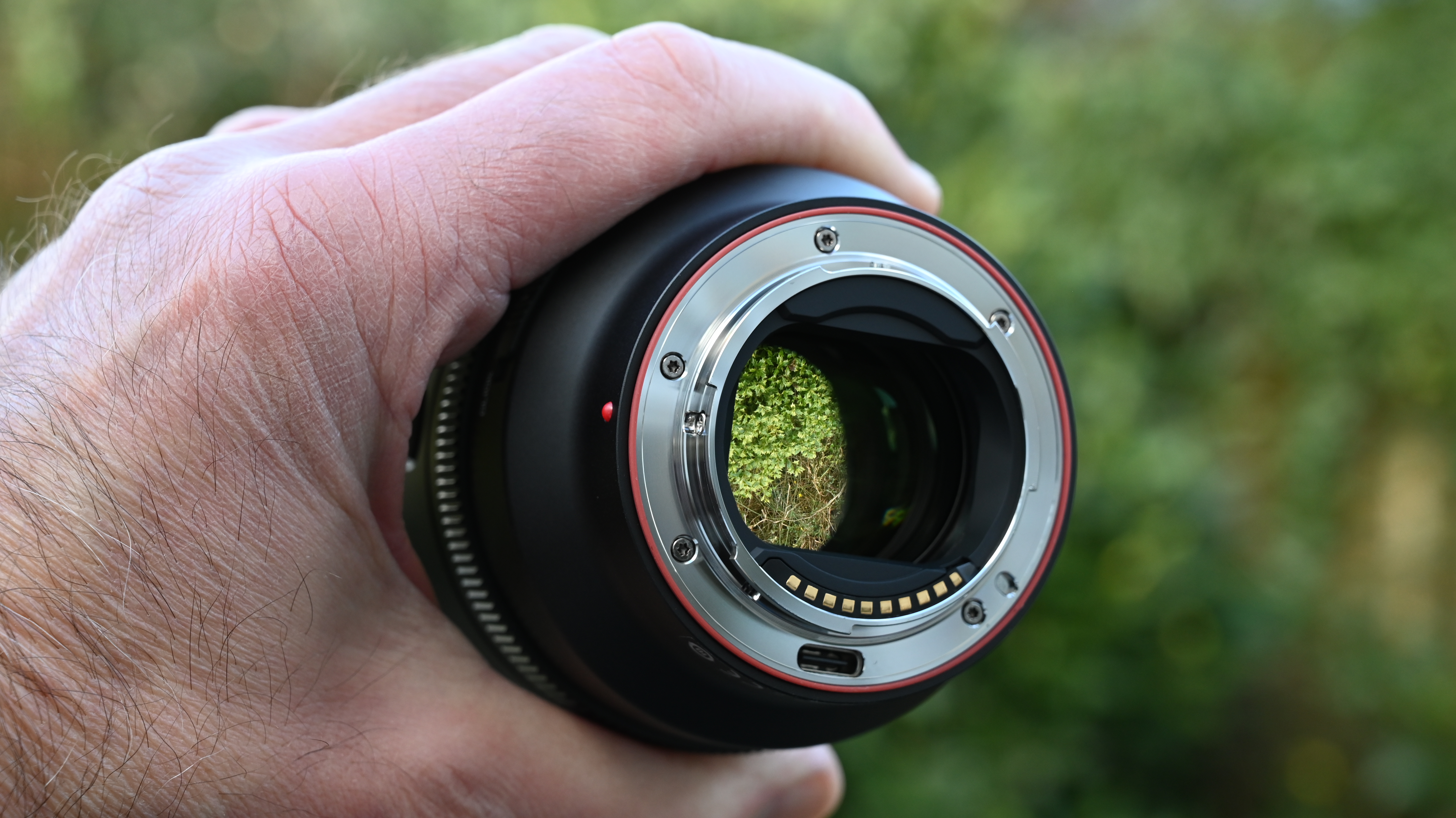 Viltrox AF 85mm f/1.4 Pro product shot, lens in hand
