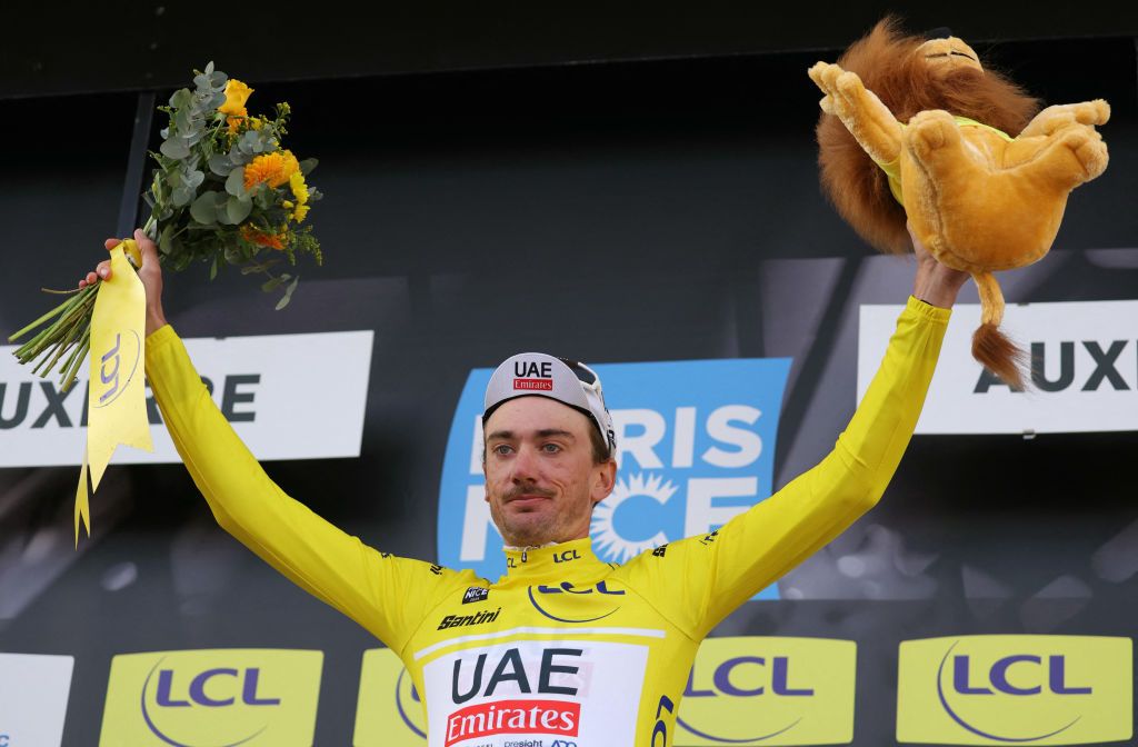 UAE Team Emirates&#039; US cyclist Brandon Mcnulty celebrates his overall leader yellow jersey on the podium after the 3rd stage of the Paris-Nice cycling race, 26,9 km team time trial between Auxerre and Auxerre, on March 5, 2024. (Photo by Thomas SAMSON / AFP)