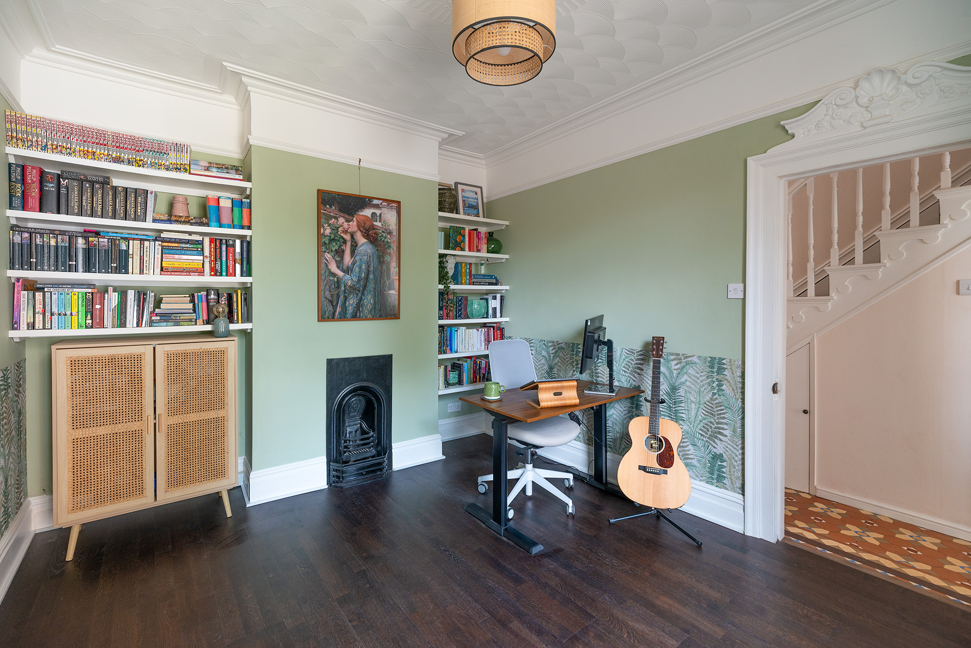 Image of office with dark wood floor and light green walls