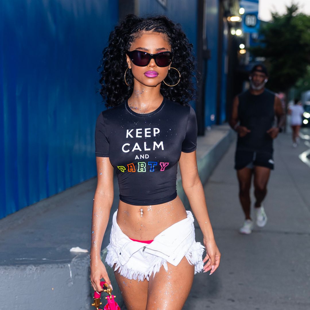 Tyla wearing sunglasses and a cropped t-shirt 