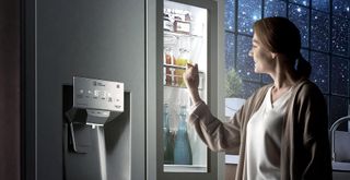 Woman opening LG Fridge Freezer