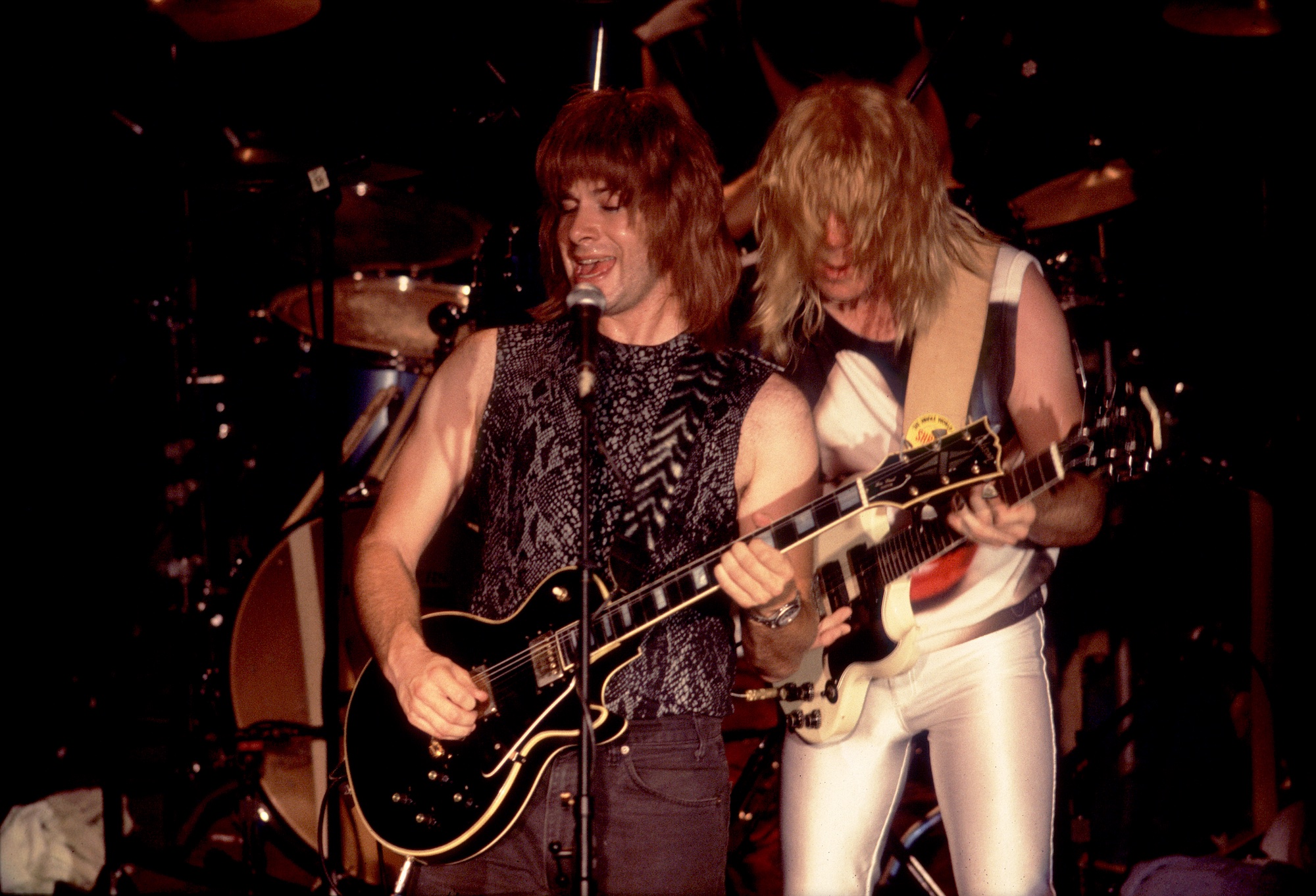 Nigel Tufnel (left) and David St. Hubbins perform onstage with Spinal Tap at the Metro in Chicago, Illinois on July 10, 1984