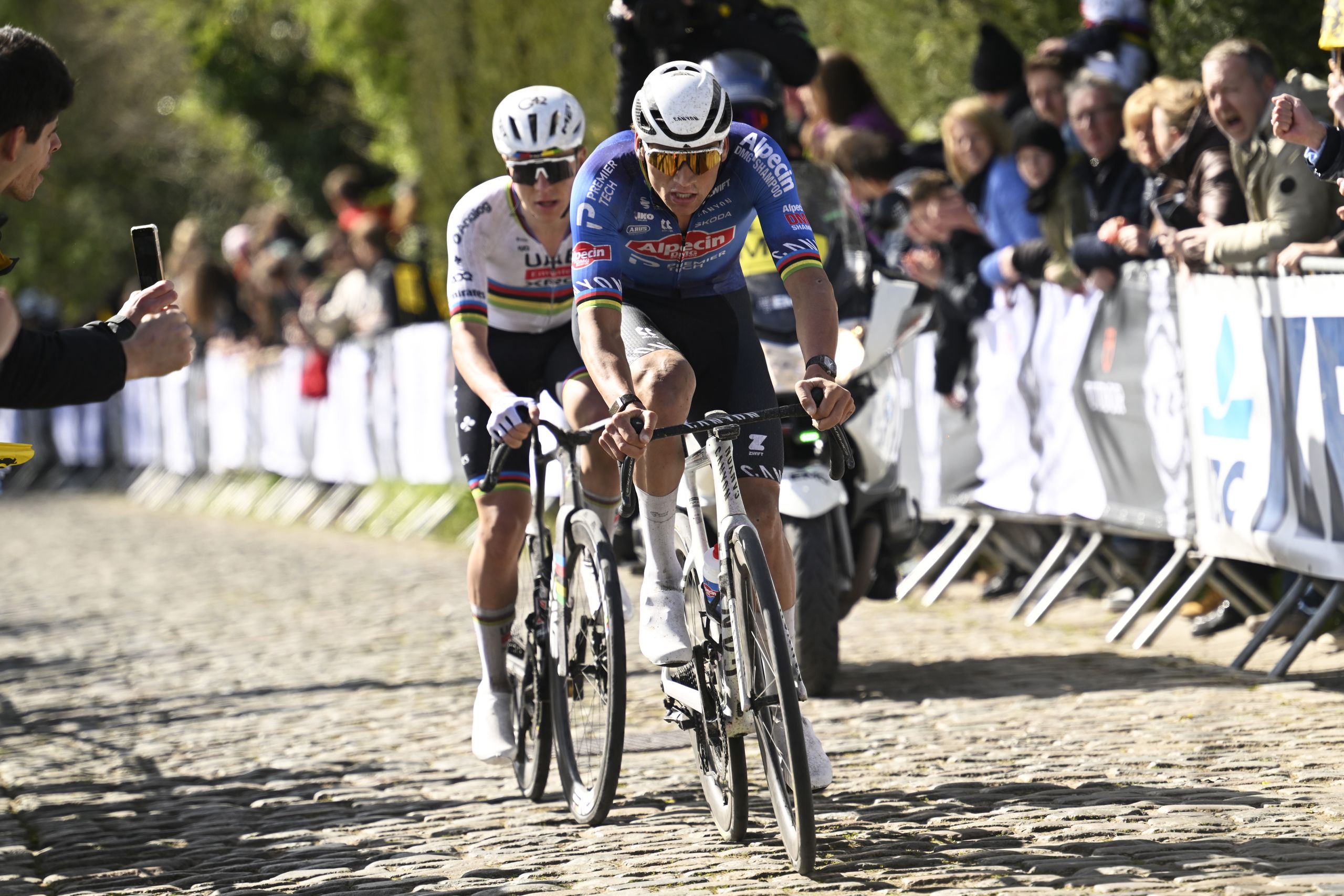Cyclists racing on cobbled roads