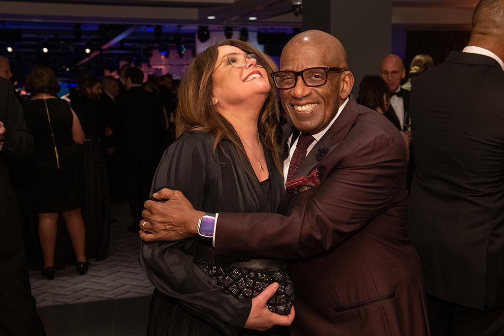 Honorees Rachael Ray and Al Roker share a moment at the opening reception.