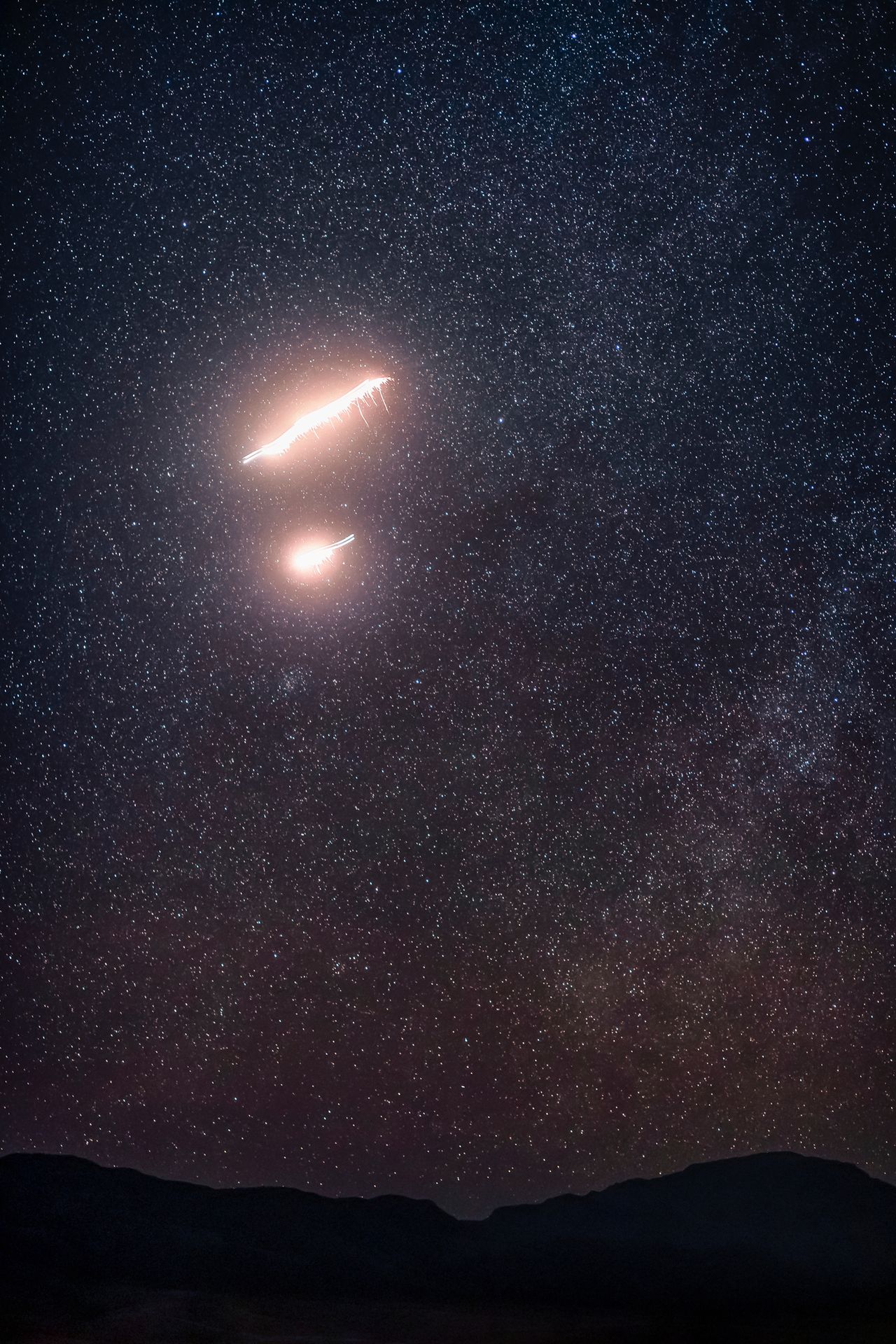 The Red Bull Air Force skydiving team paint the night sky in dazzling "Marfa lights" near Marfa, Texas in these amazing images by photographer Dustin Snipes to celebrate the night sky for the winter solstice 2020. The jump took place in November 2020.