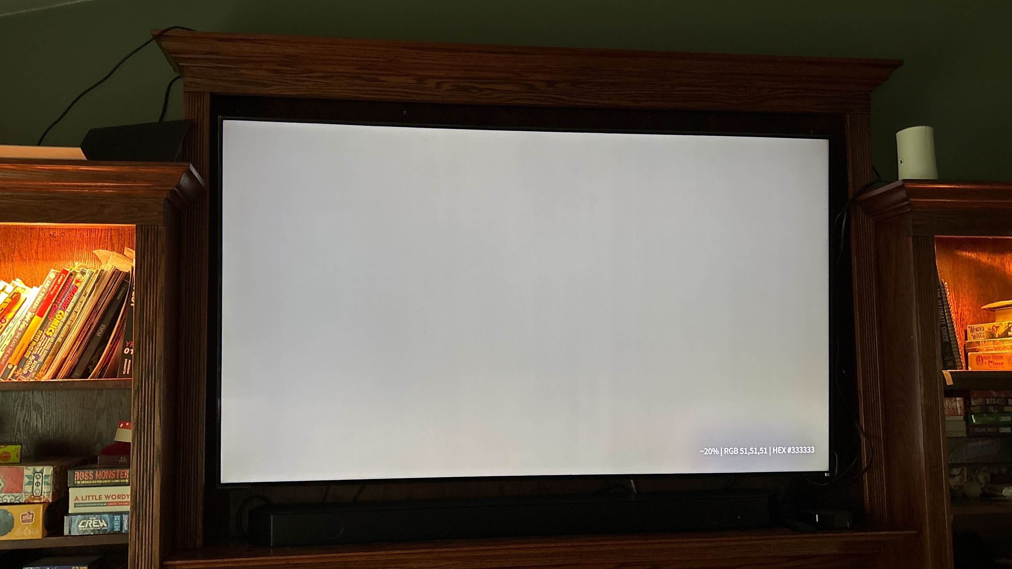 A Vizio P Series Quantum X TV displaying a light gray-colored slide, which is revealing faint lines and shadows on the panel