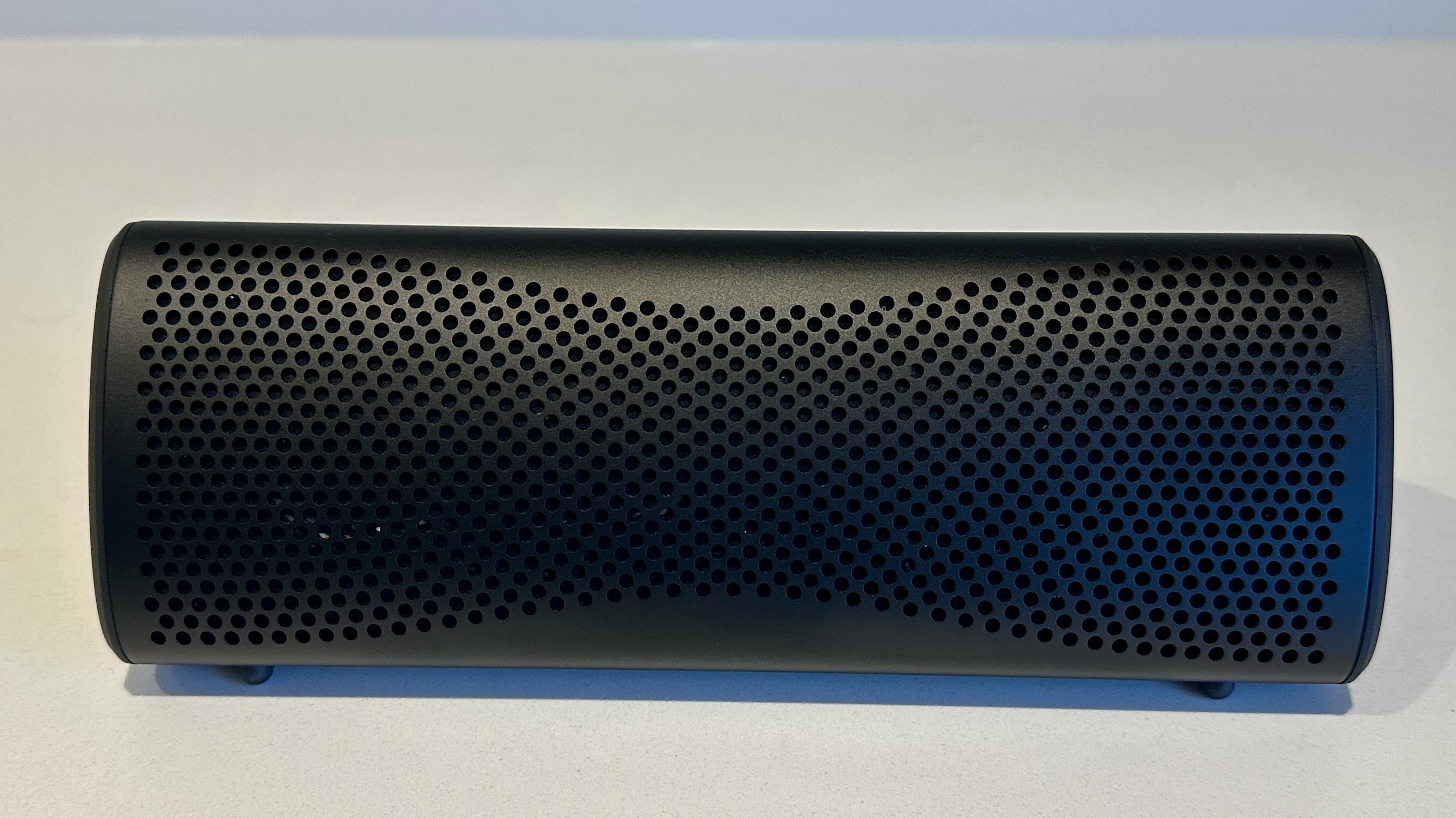 KEF Muo 2025 in black, on a white table