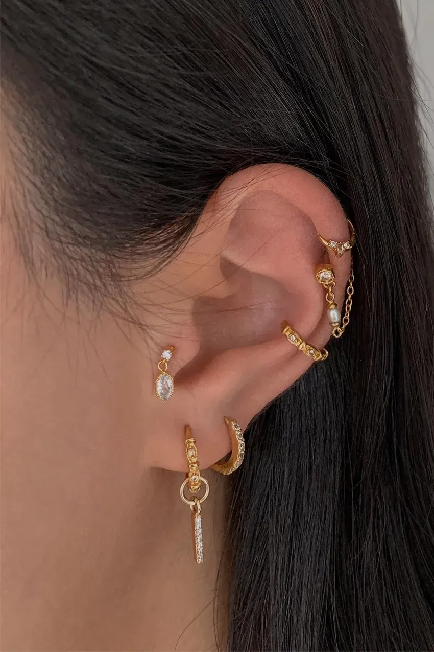 Woman wears diamond earrings
