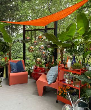 orange shade sail at show garden chelsea flower show 2022