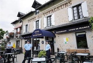 French Gendarmes keep watch on the Hotel des Voyageurs