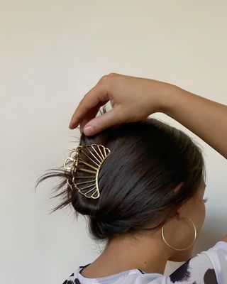 gold claw clip in hair