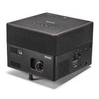 A cube-shaped Epson EF-12 projector in black on a white background